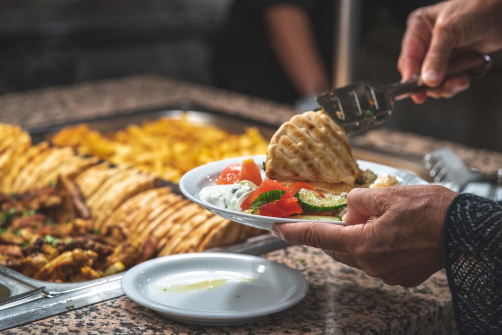 guests serving cretan food from buffet